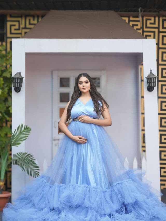 celestial grace maternity gown on an expecting mom main, studio portrait.