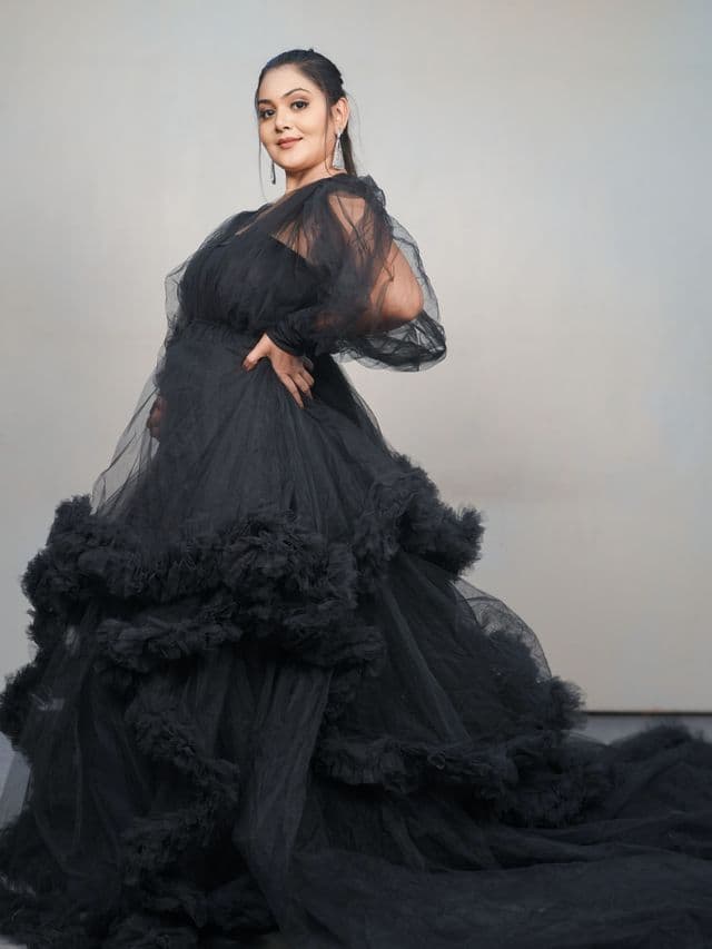 midnight majesty maternity gown on an expecting mom front main, studio portrait.