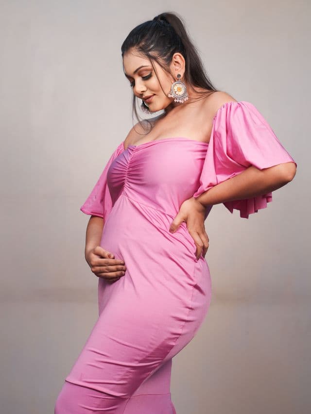 pink radiance maternity gown on an expecting mom front main, studio portrait.