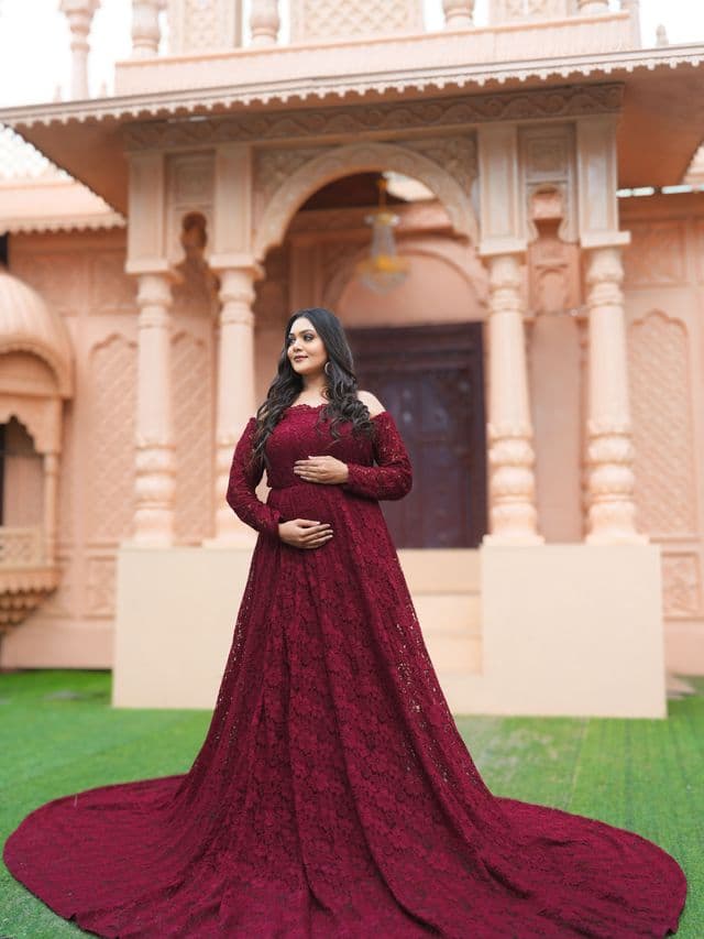 ruby royale maternity gown on an expecting mom front main, studio portrait.