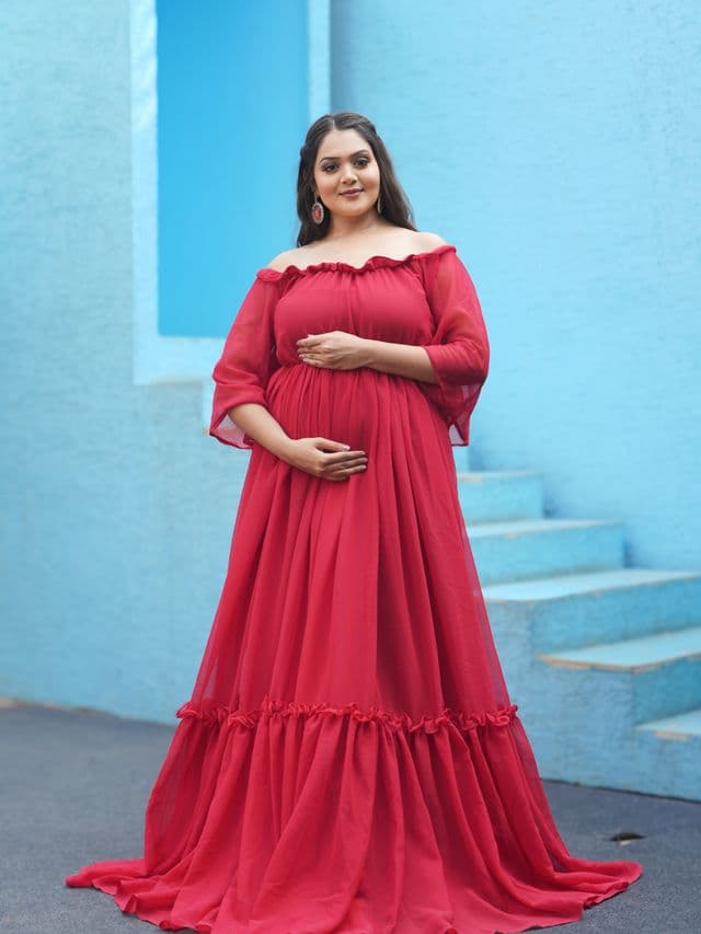 scarlet dream maternity gown on an expecting mom front main, studio portrait.
