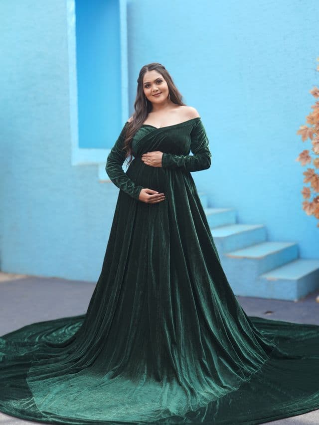 verdant vogue maternity gown on an expecting mom front main, studio portrait.